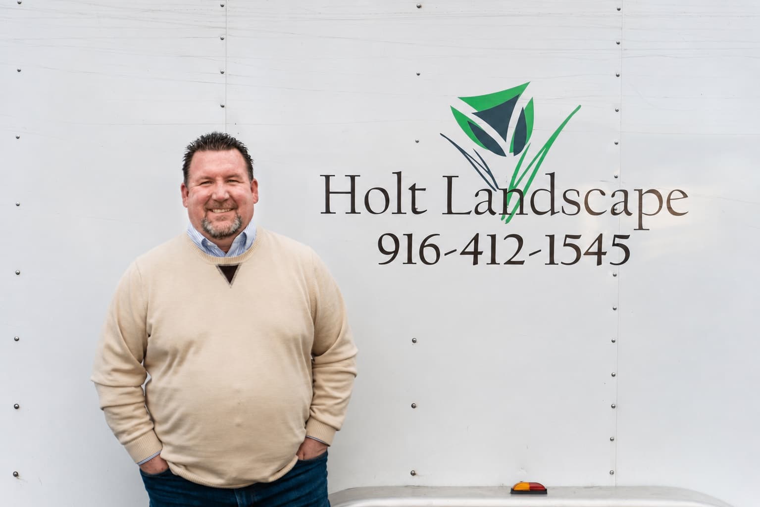 Gary Holt reviewing a residential landscape construction plan with a client